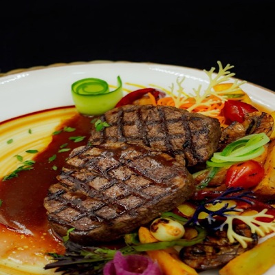Grilled steak at Danial’s Cuisine, Kestel — tender beef with rich sauce and fresh vegetables